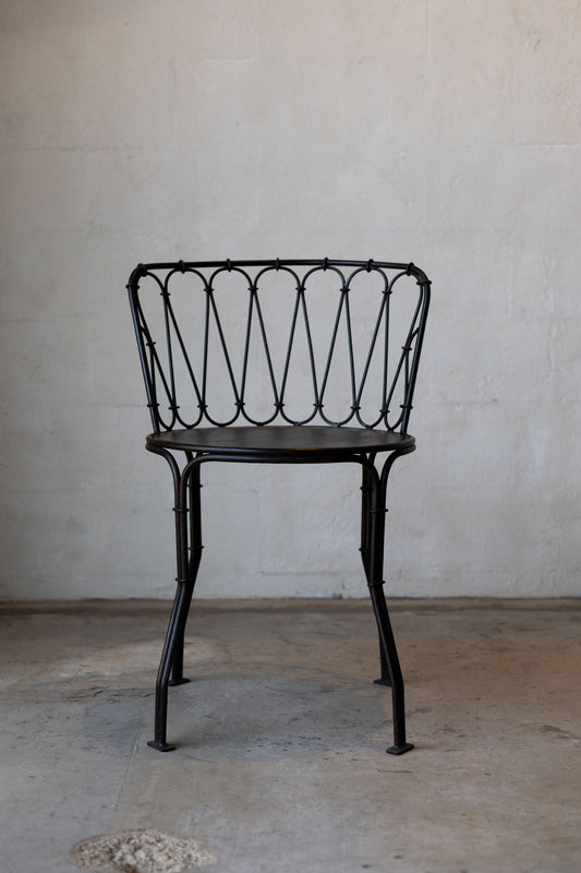 Iron French bistro style dining chair.