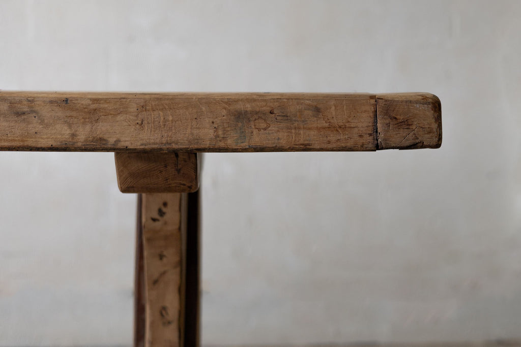 Close-up of wooden dining table top profile and silhouette with rustic tone.