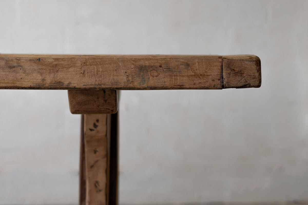 Close-up of wooden dining table top profile and silhouette with rustic tone.