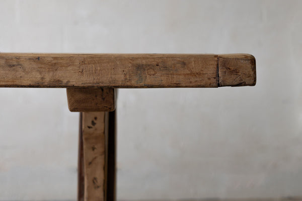 Close-up of wooden dining table top profile and silhouette with rustic tone.