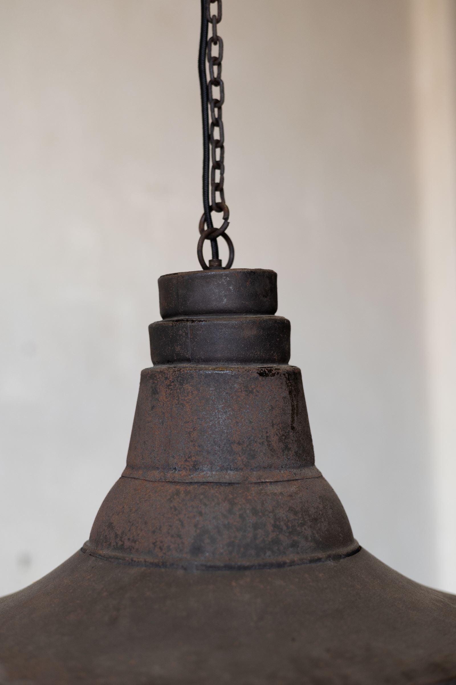 Top of antique industrial pendant light.