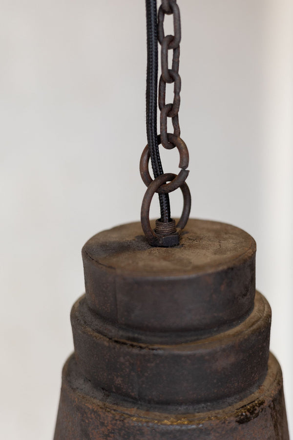 Close up of antique industrial pendant light chord and chain. 