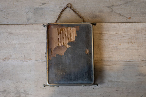 Back of barber mirror panel showing ware one cardboard back. 