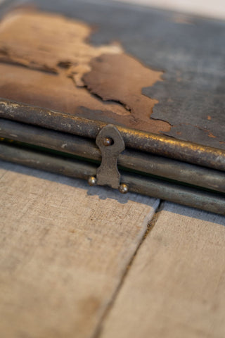 Close-up of an old, rusty metal lock on barber mirror.
