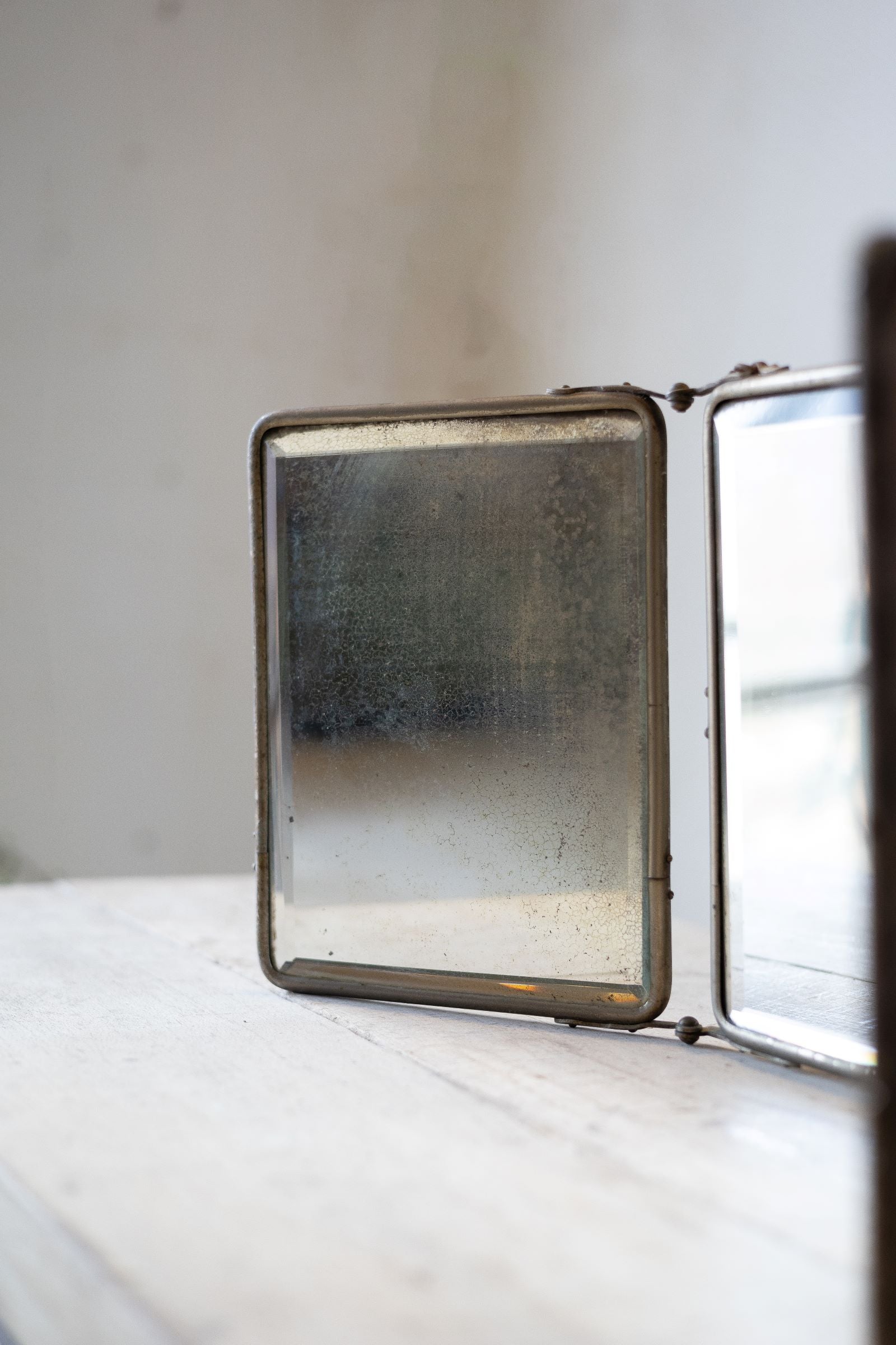 Single panel of barber mirror on a white background
