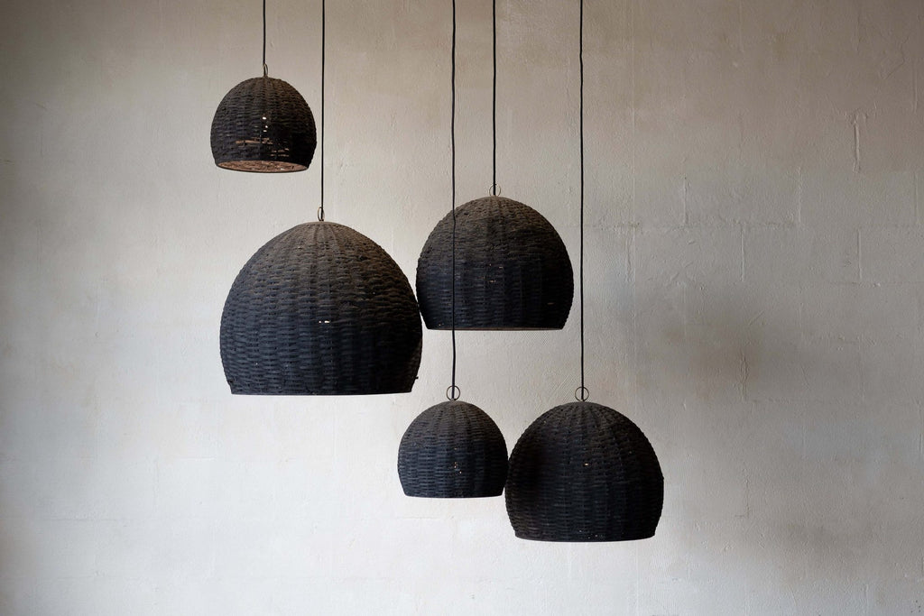 Group of five beehive pendant lights hanging at different heights with different sizes. 