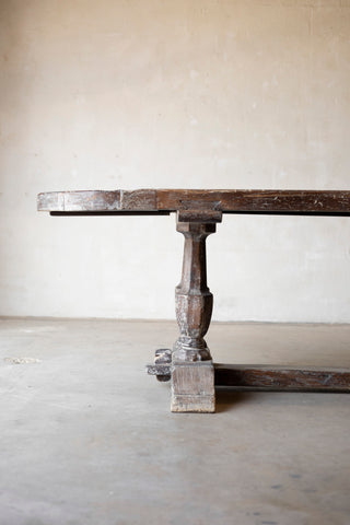 Wooden table with a rustic design on a plain background