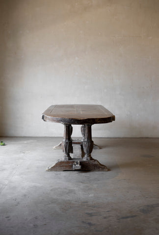 Vintage wooden table against a plain wall