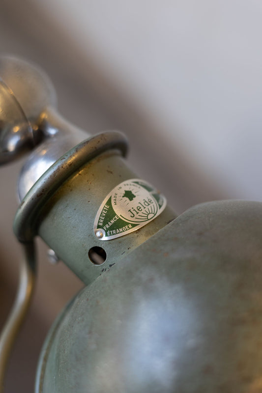 Jielde tag on green task lamp.