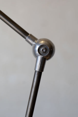 Close up of spherical angle joint of Jielde industrial desk lamp. 
