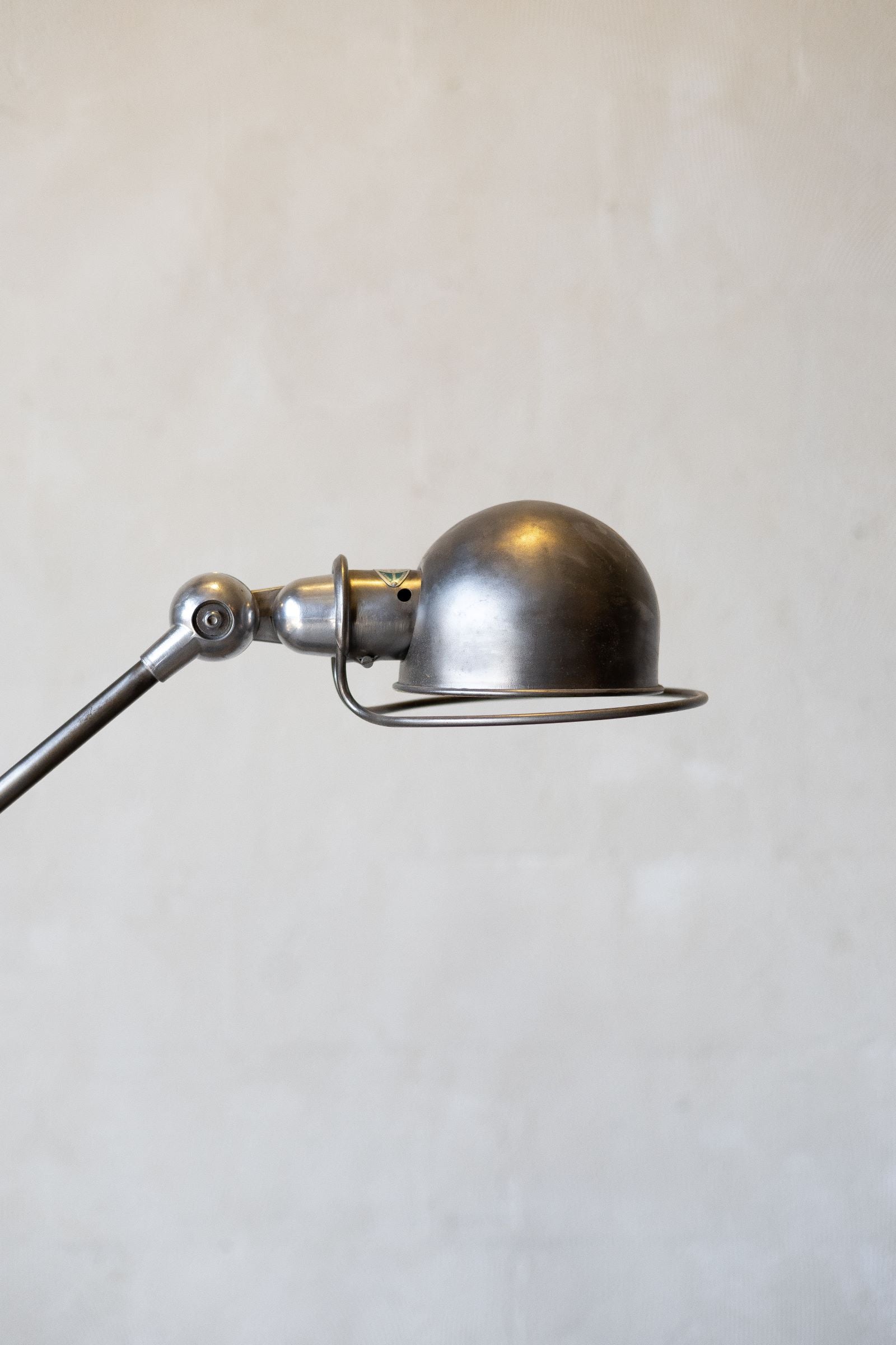 Vintage-style metal wall lamp on a plain background