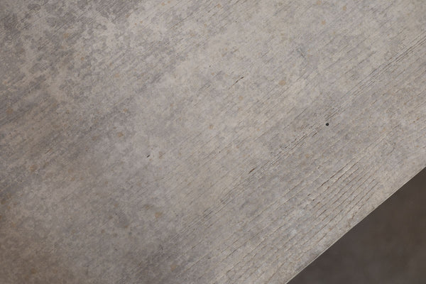 Close-up of a textured wooden surface of trestle table. 