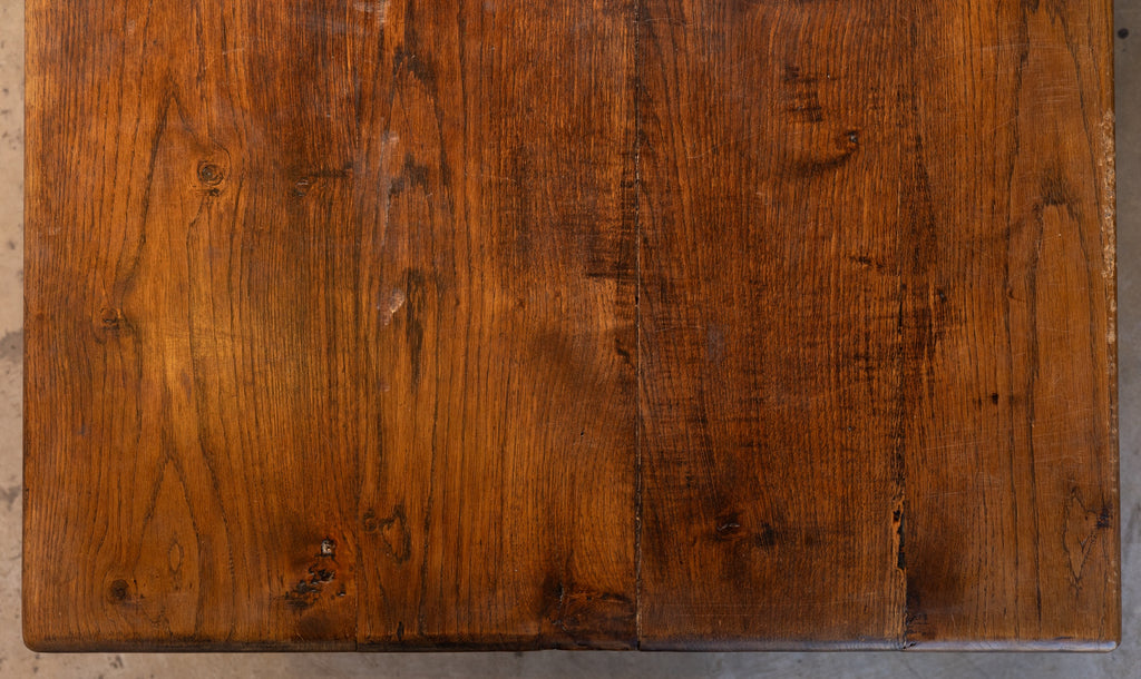Close-up of a wooden surface with visible grain and texture.