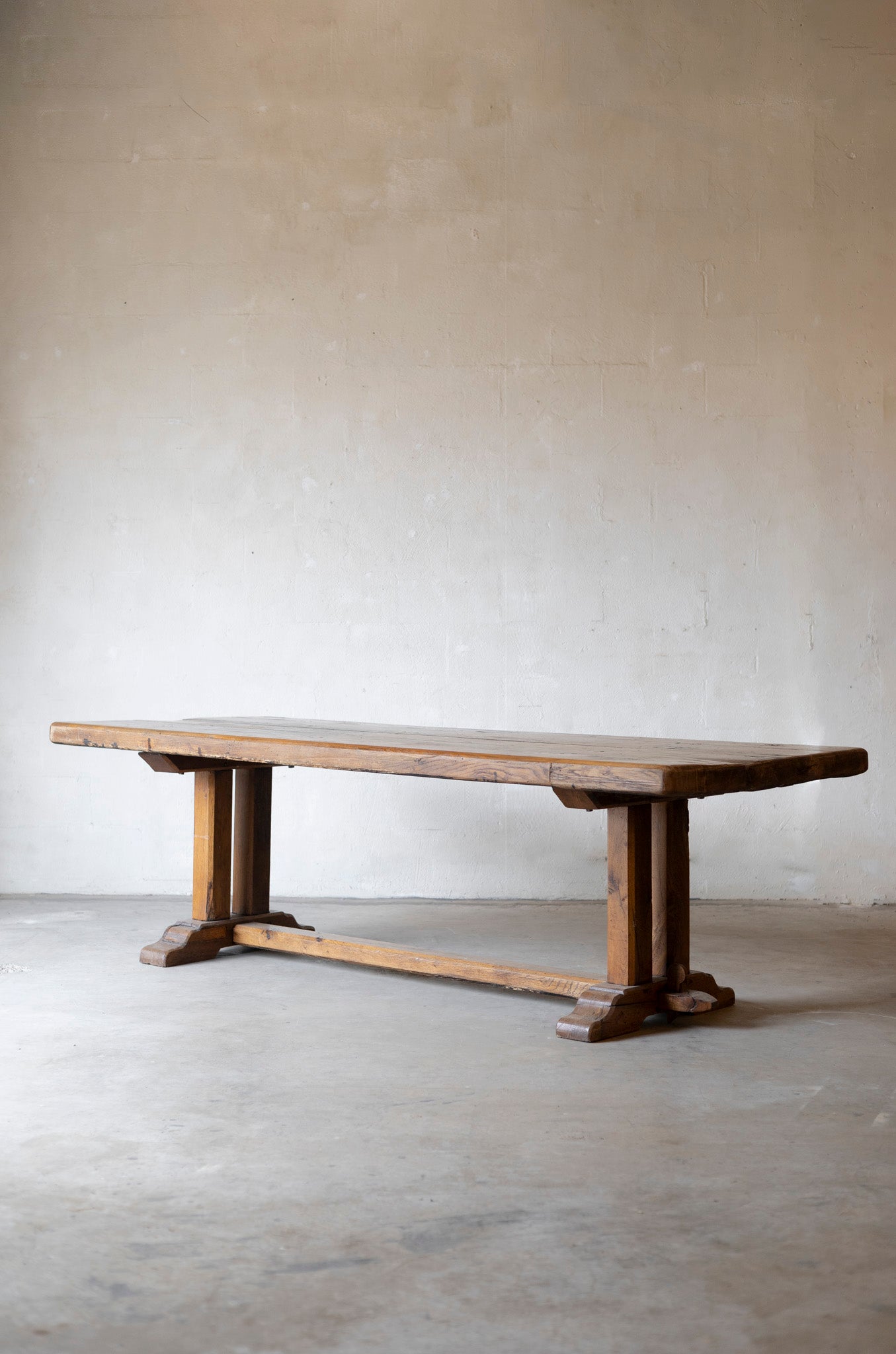 Wooden table against a plain wall