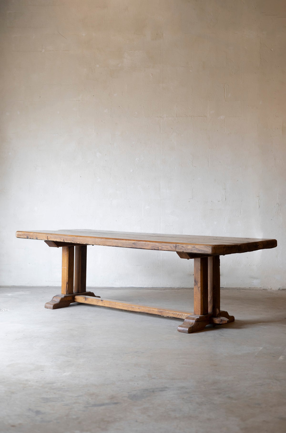 Wooden table against a plain wall