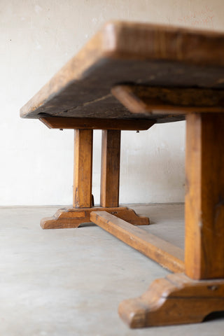 Wooden table with a rustic design on a plain background