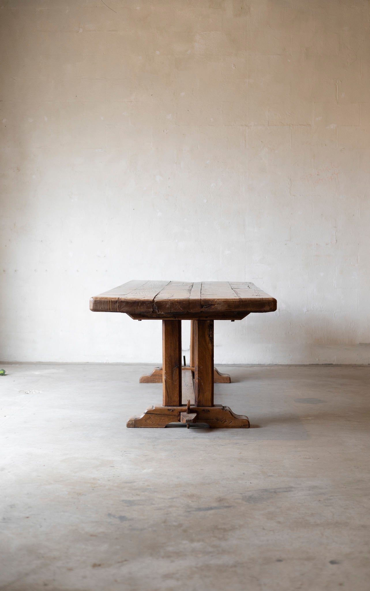 Wooden table against a plain white wall