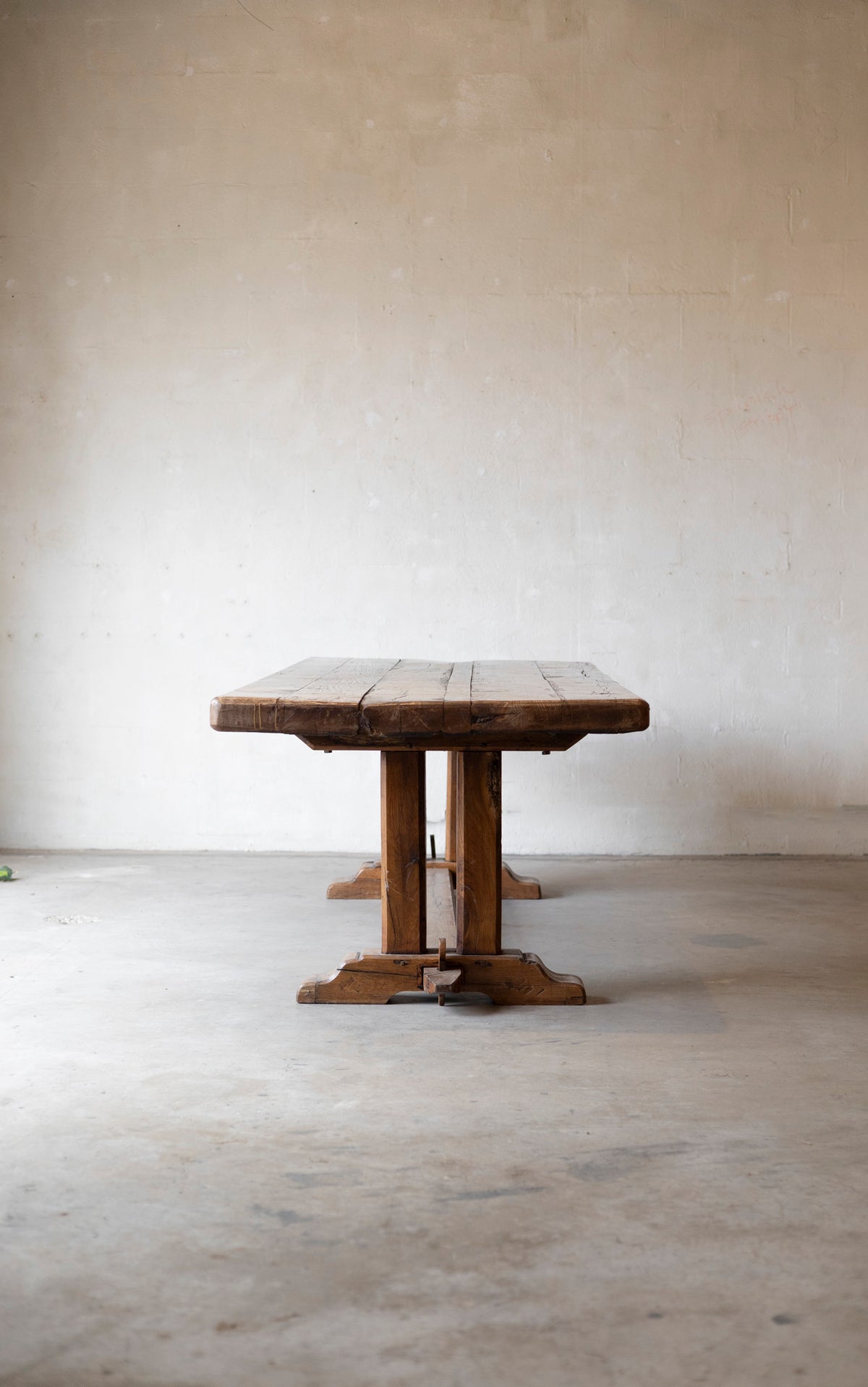 Wooden table against a plain white wall