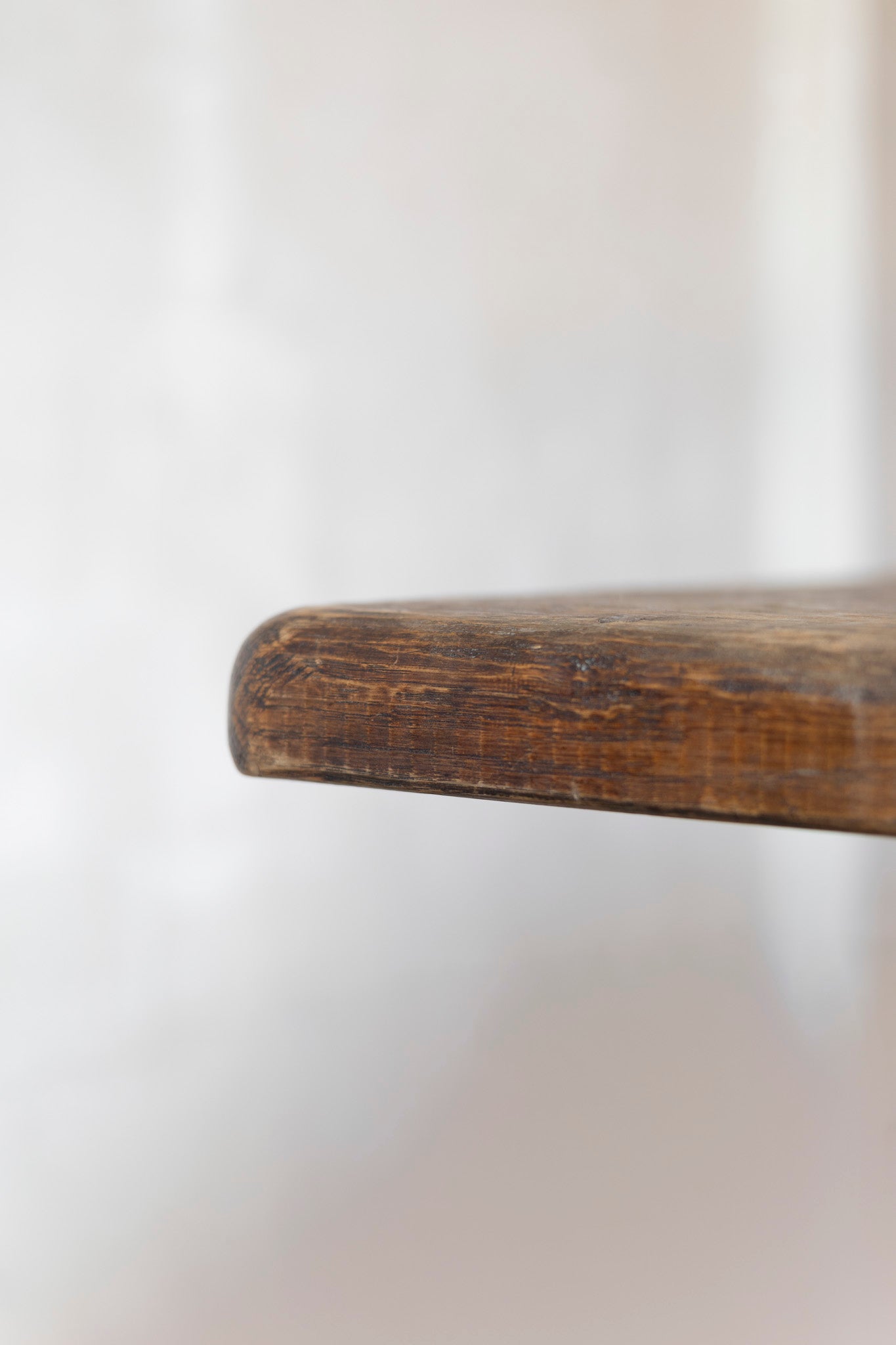 Close-up of a table surface with a blurred white background