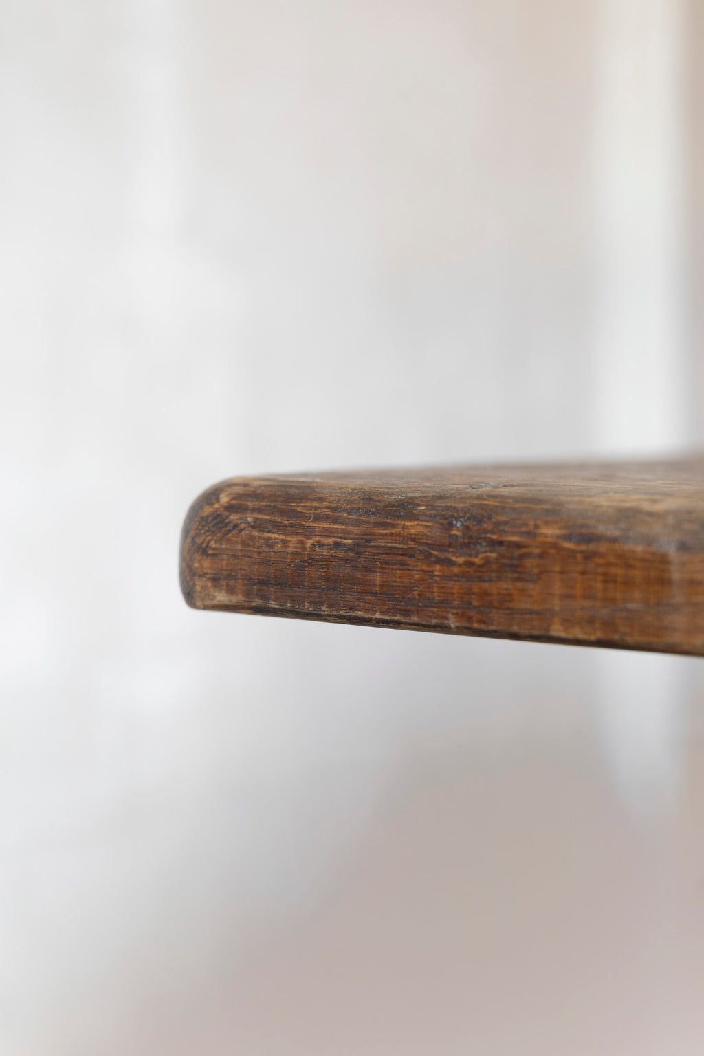 Close-up of a table surface with a blurred white background