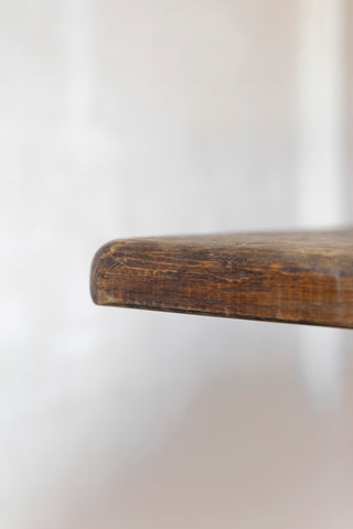 Close-up of a table surface with a blurred white background
