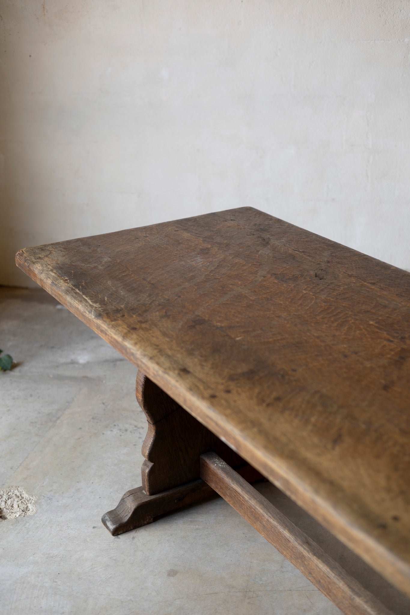 Vintage wooden table against a plain wall