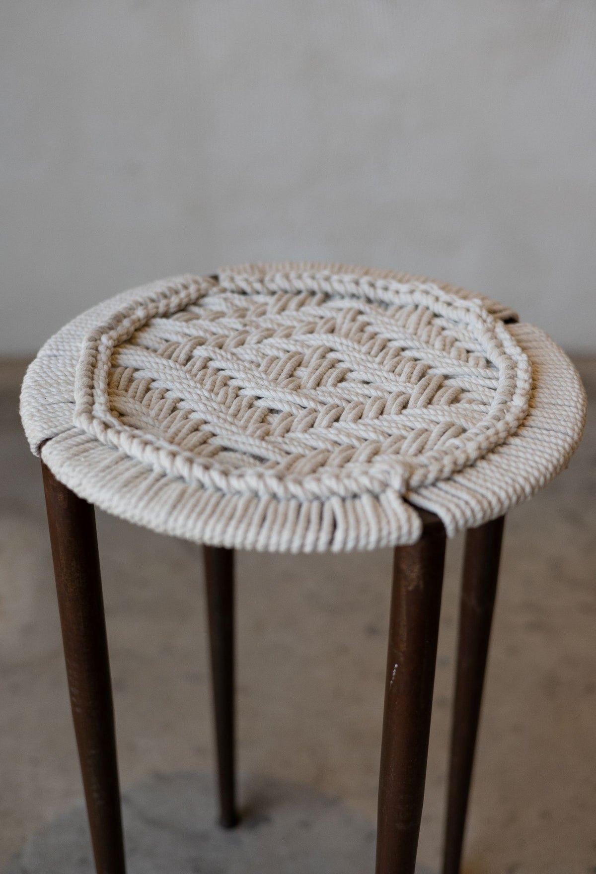 close up of intricately woven cotton stool seat.