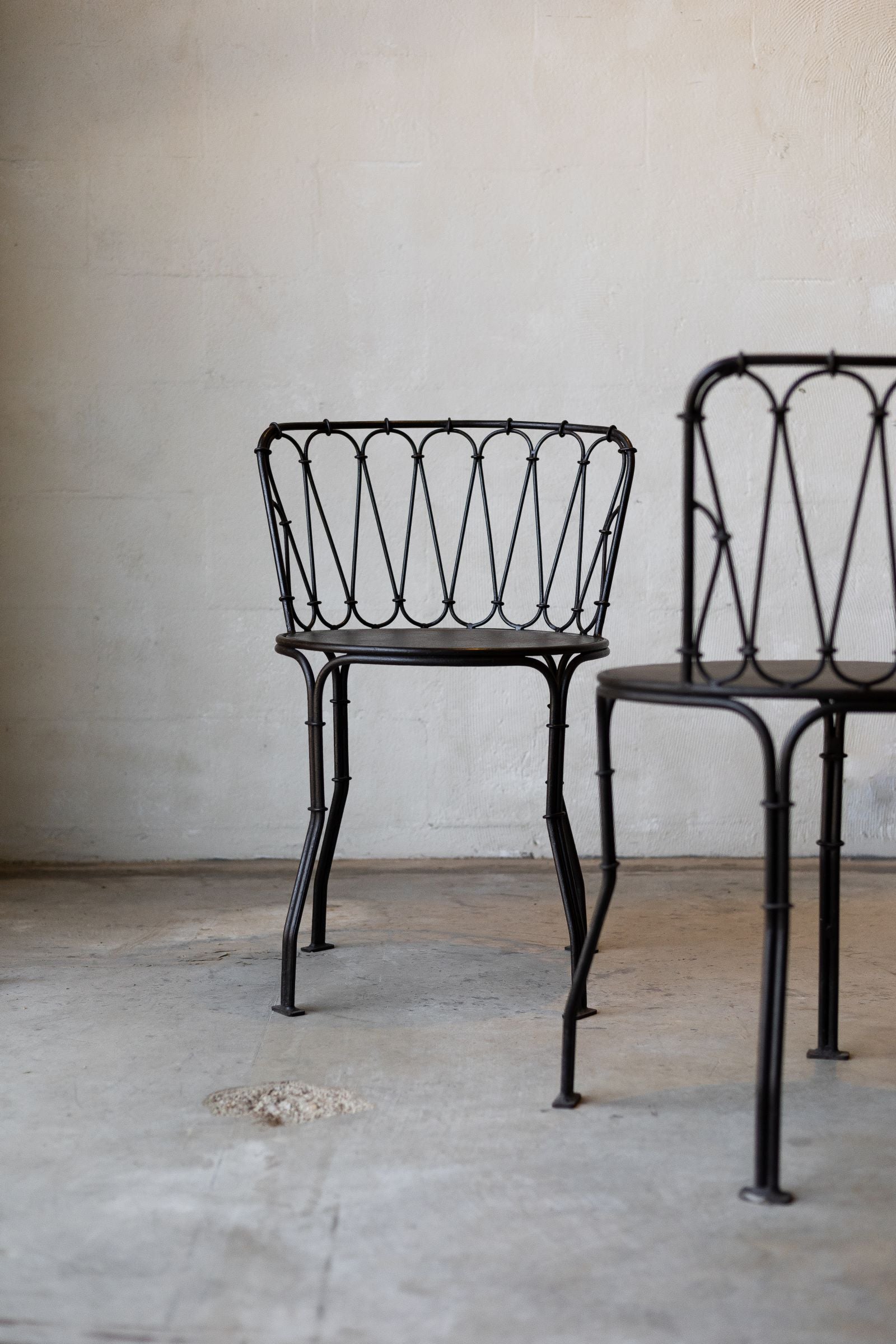Pair of iron French bistro style dining chair. 