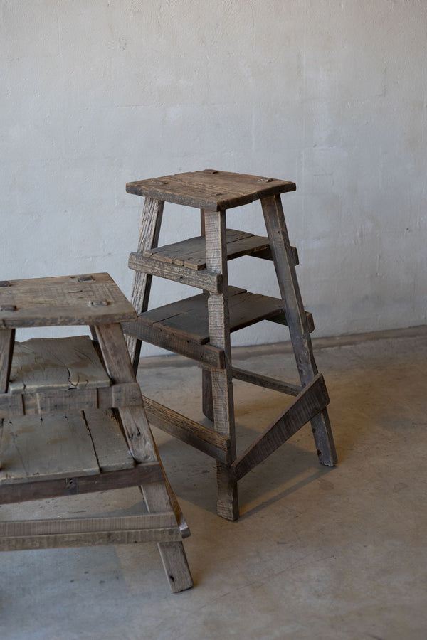 Pair of rustic wood painter stools of different heights. 