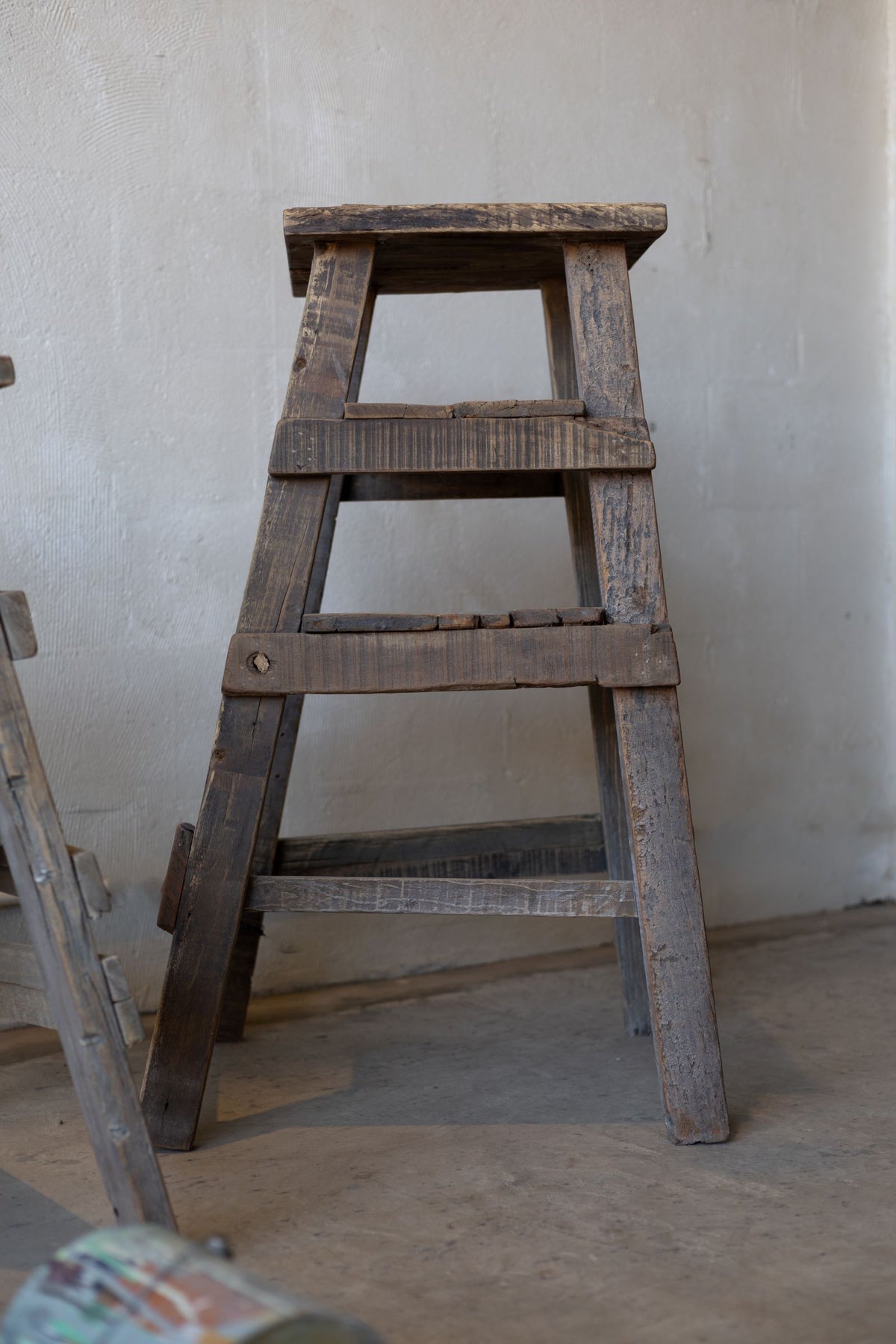 Rustic wood painter stool. 