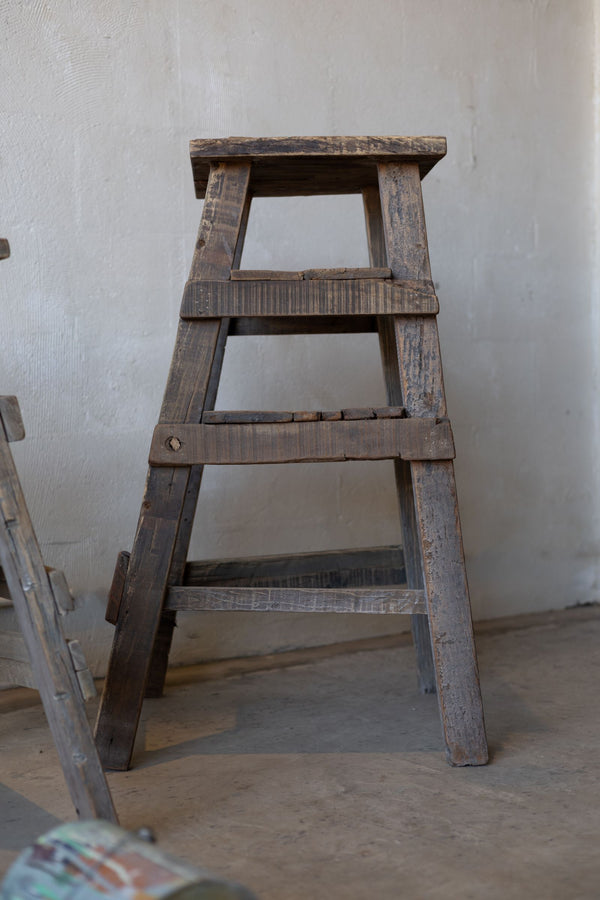 Rustic wood painter stool. 
