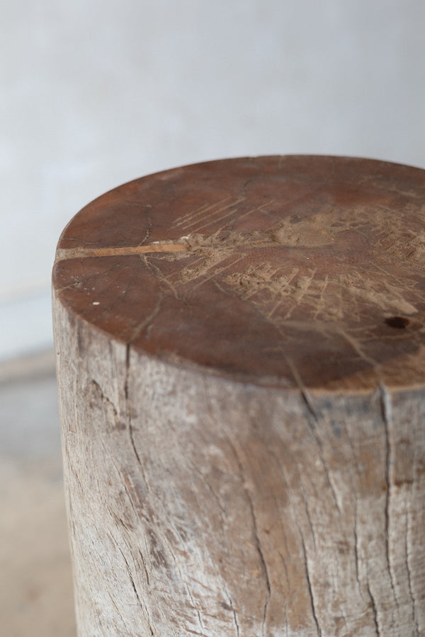 Close-up of butcher block table top with natural rings and wear. 