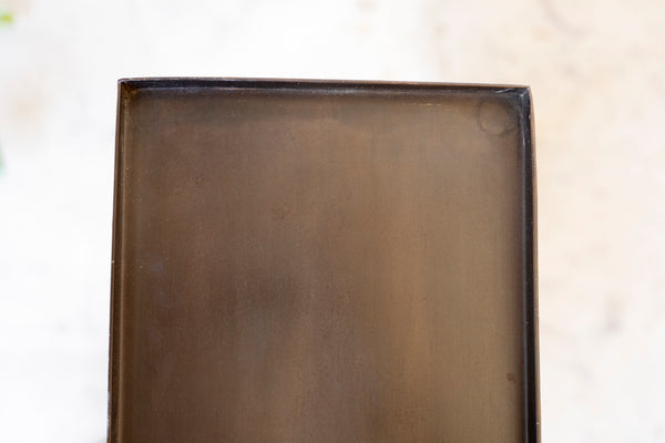Rectangular metal tray on a light background