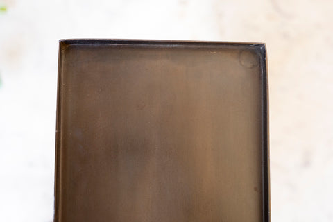 Rectangular metal tray on a light background