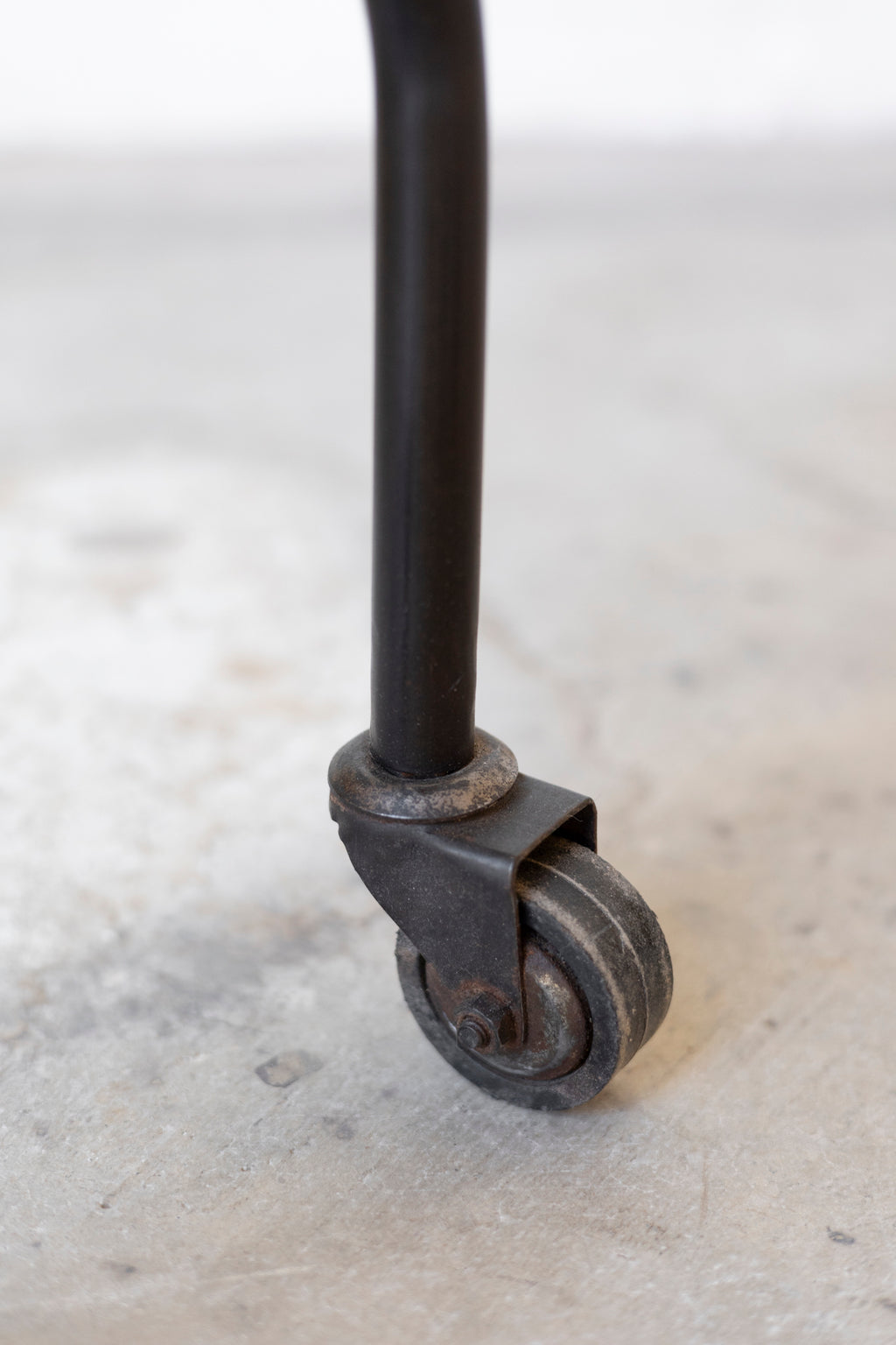 Metal caster wheel on a concrete floor