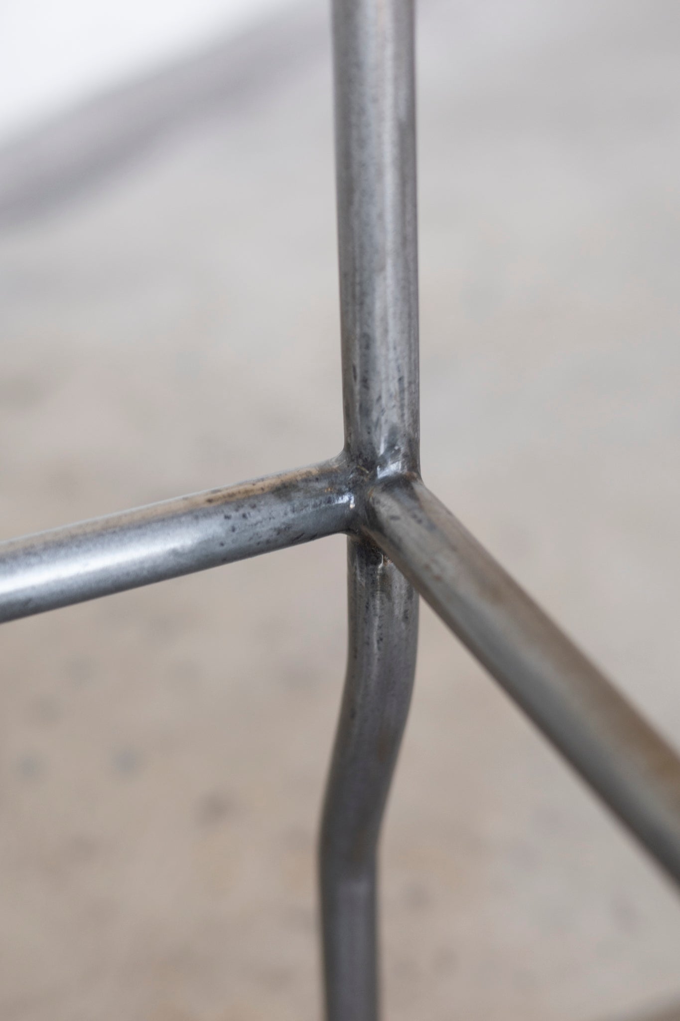 Close-up of a metal grid structure with a blurred background