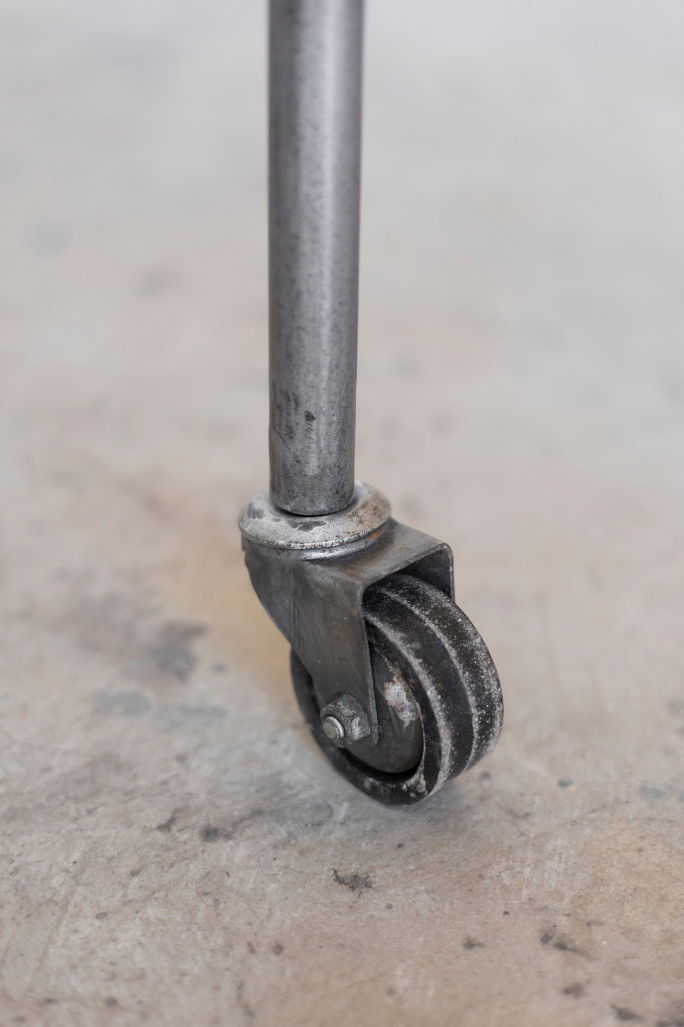 Metal caster wheel on a concrete floor