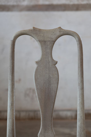 Back of vintage dining chair with arches.