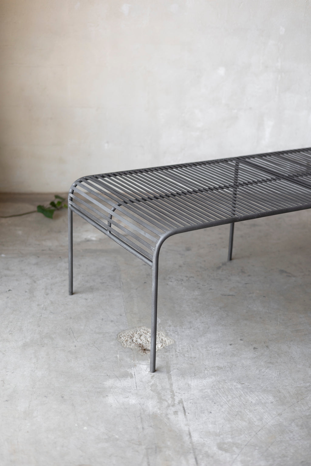 Metal coffee table with a minimalist design on a plain background