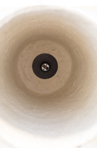 Close-up of the inside of textured white pendant light. 