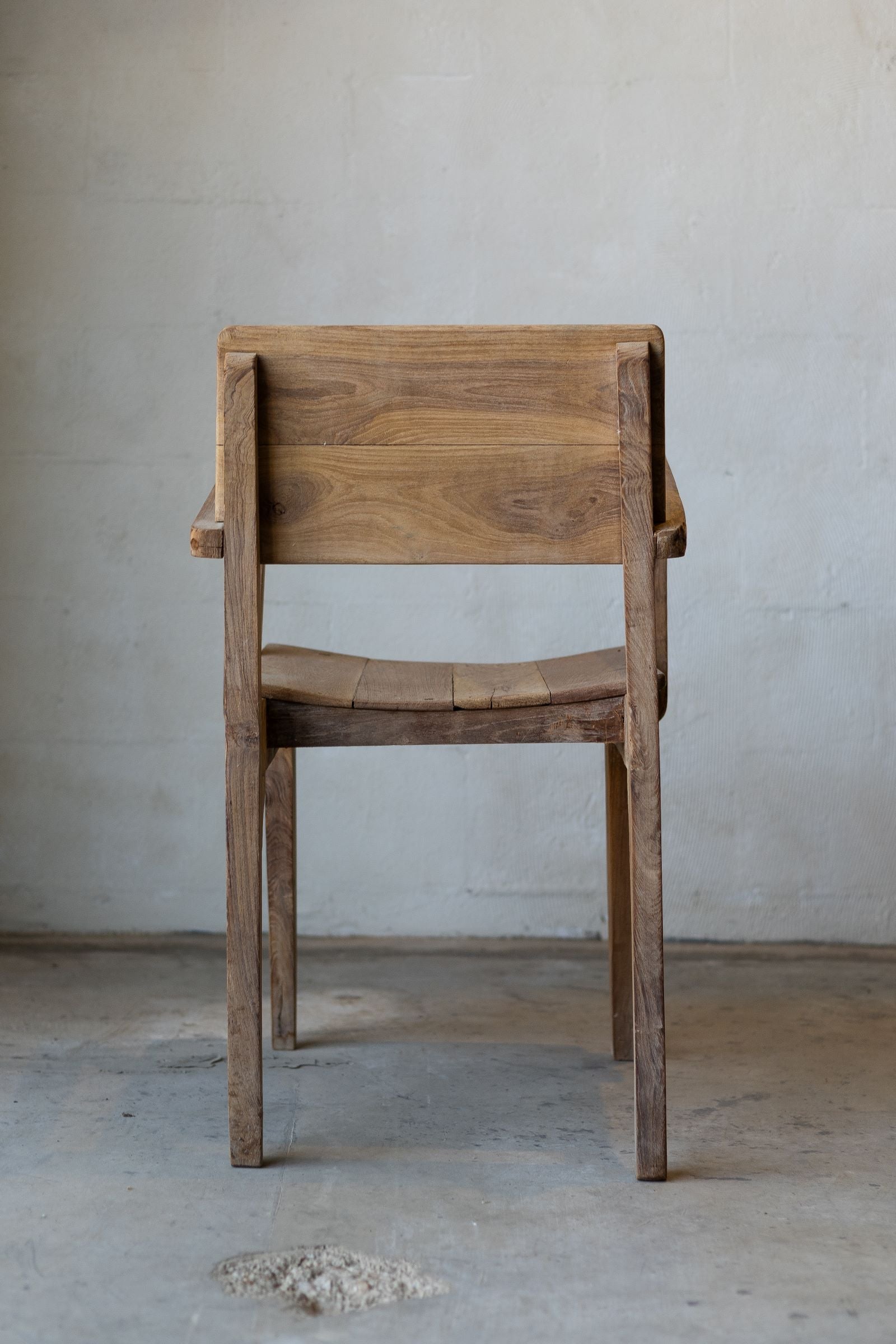 Back of antique art deco wood dining chairs. 