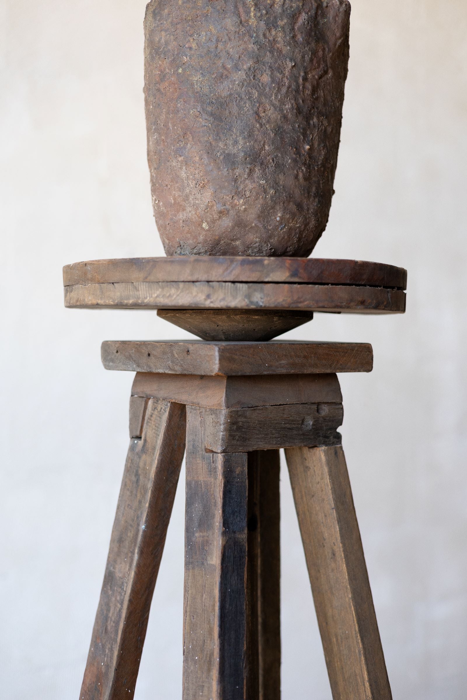 Pedestal of reclaimed wood sculpture stand.