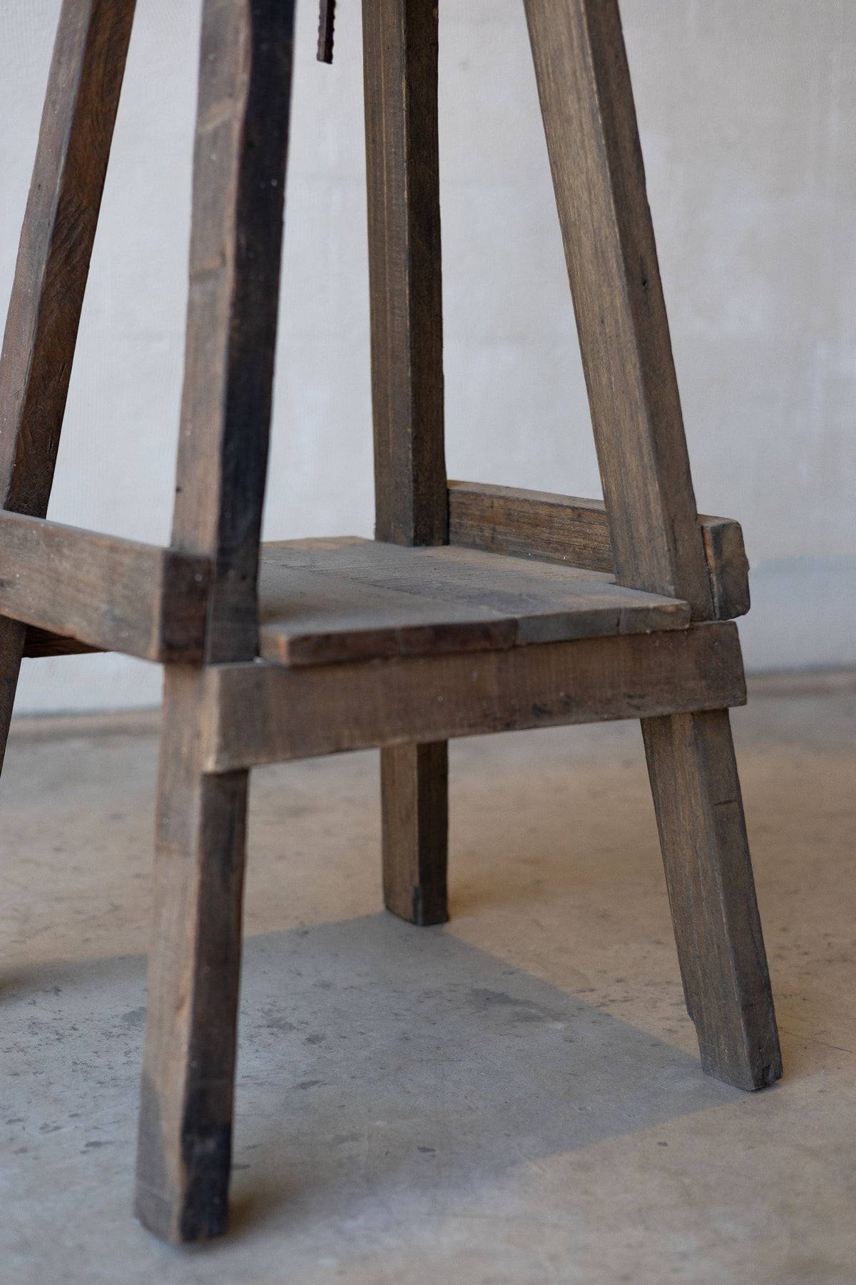Feet of reclaimed wood sculpture stand.