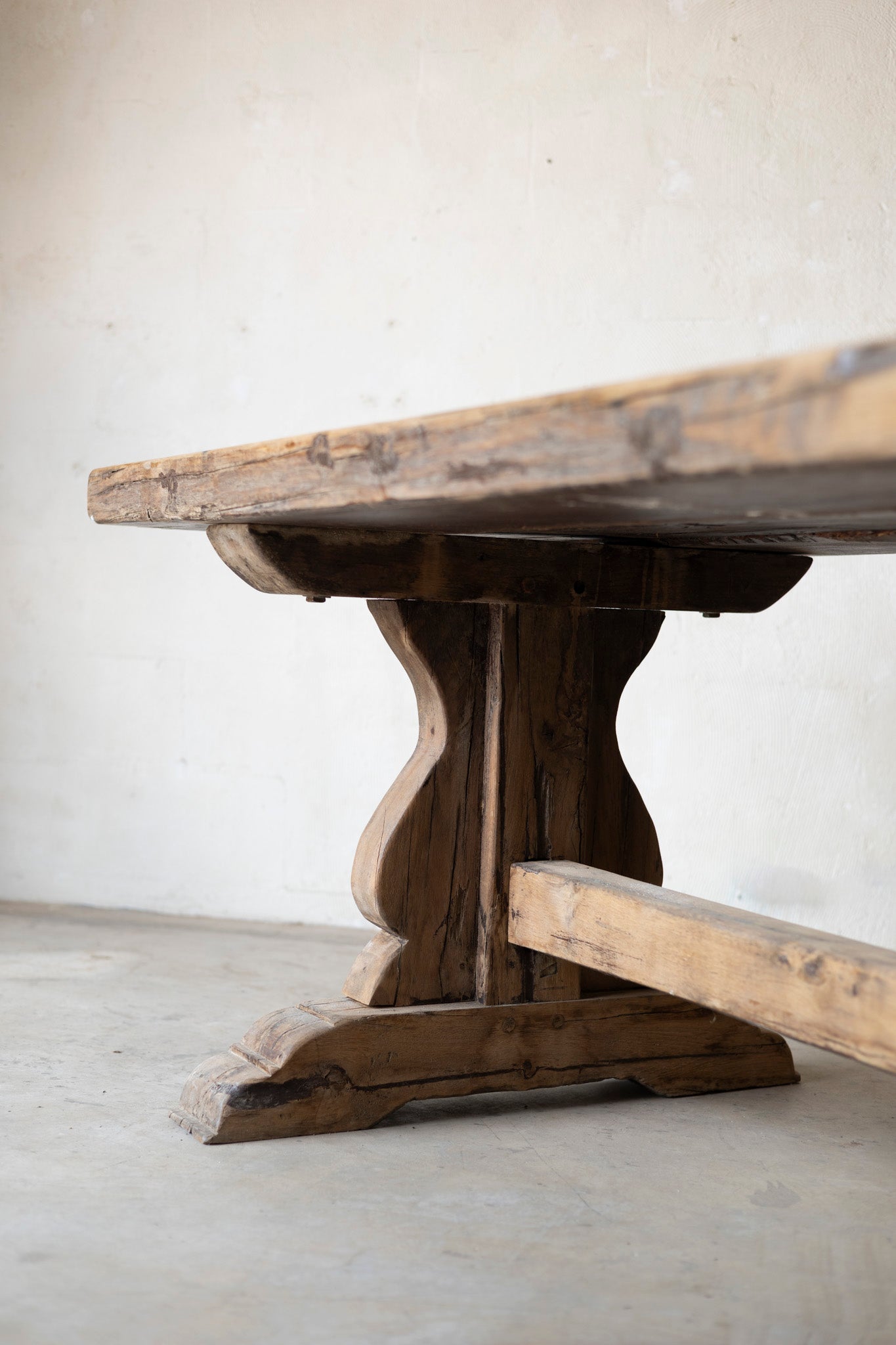 Wooden table with rustic design on a plain background
