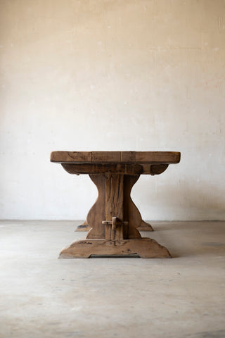 Wooden table with a rustic design on a plain background