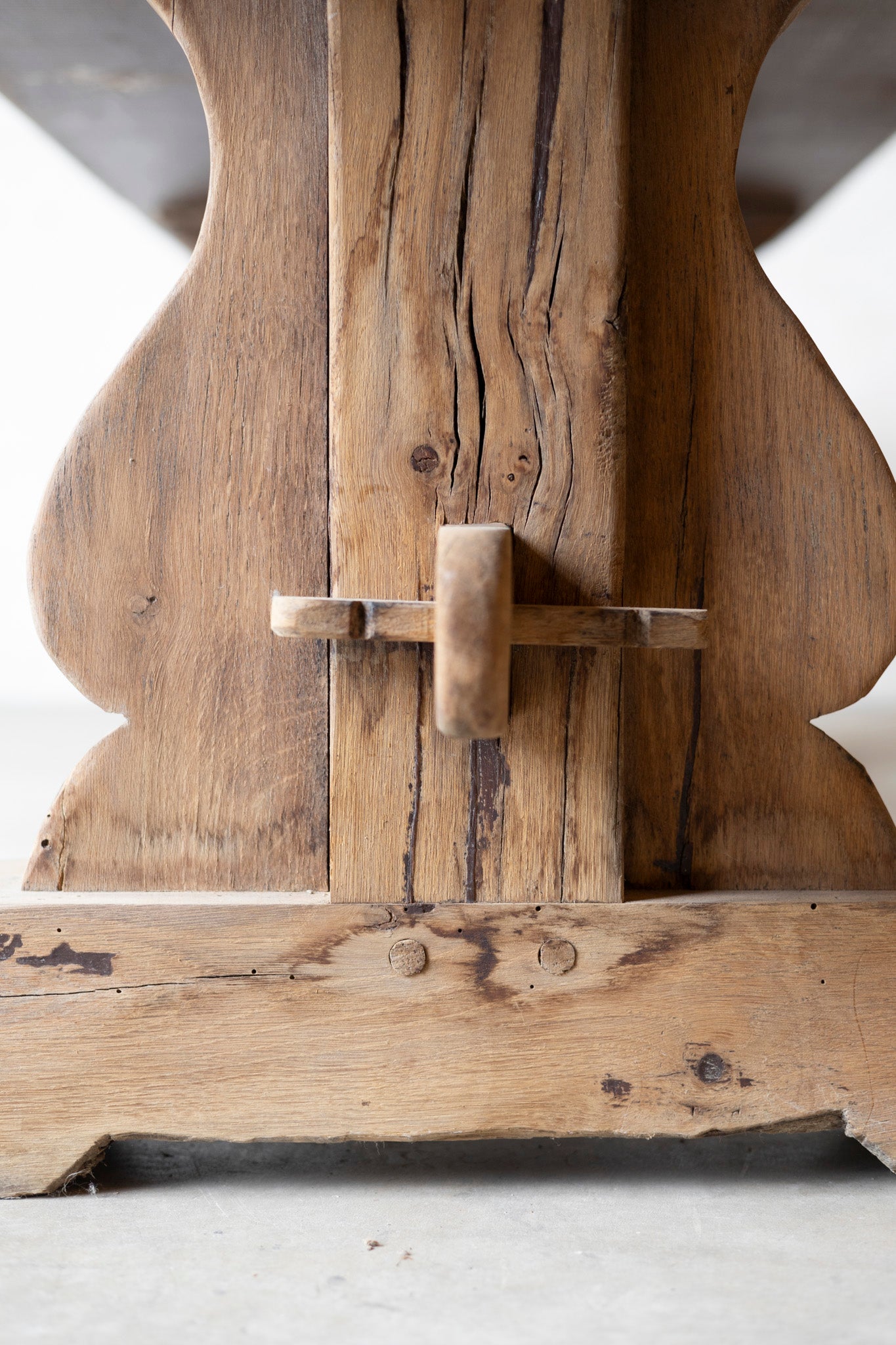 Close-up of a wooden Table element with intricate carvings on a white background