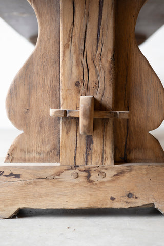 Close-up of a wooden Table element with intricate carvings on a white background