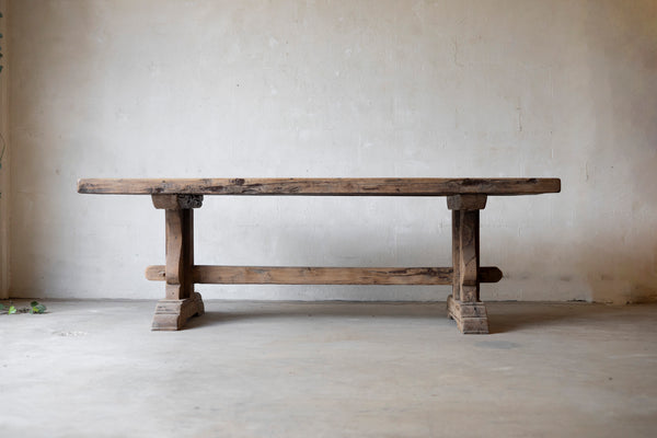 Wooden Table against a plain wall