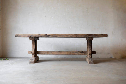 Wooden Table against a plain wall