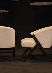 a pair of white chairs sitting next to each other